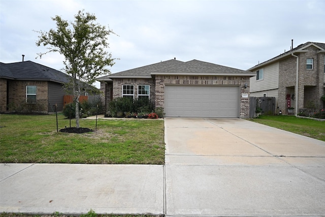 single story home with a garage and a front lawn