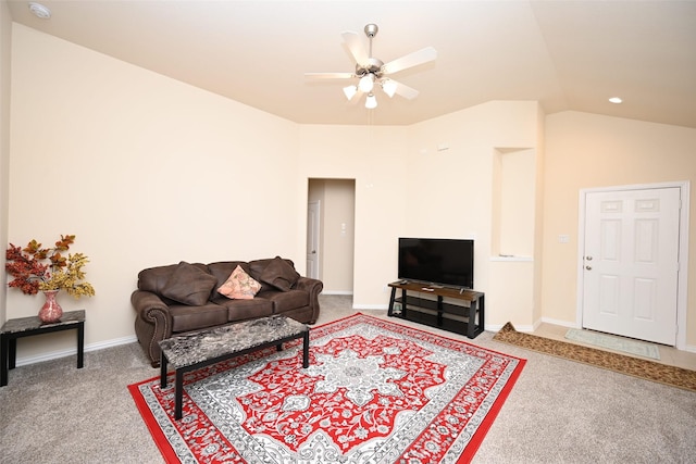 living room featuring carpet floors, ceiling fan, and lofted ceiling