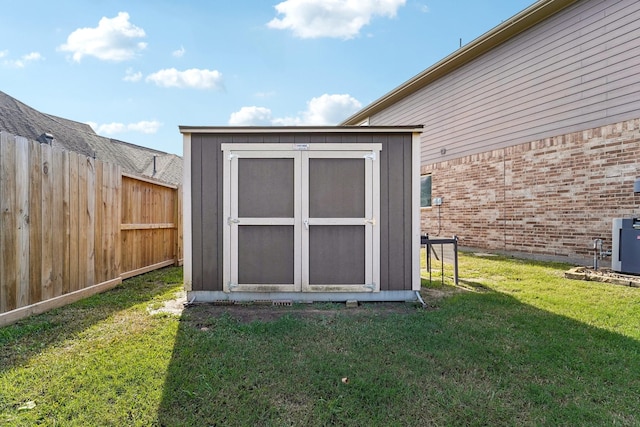 view of outbuilding featuring a lawn