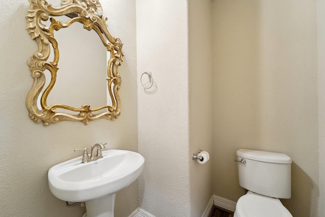 bathroom with sink and toilet