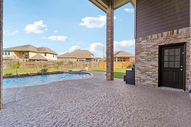 view of pool featuring a lawn, an in ground hot tub, and a patio