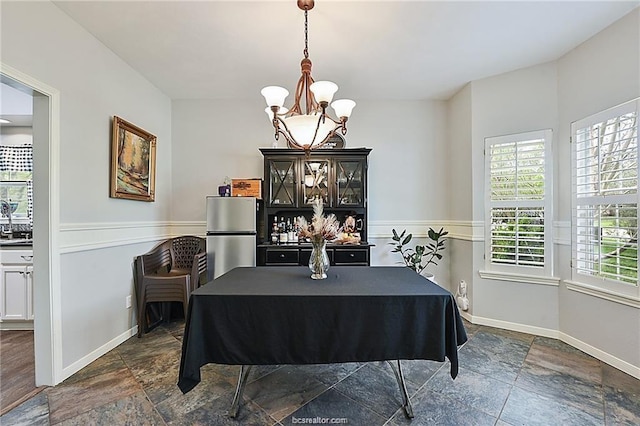 dining room featuring a notable chandelier