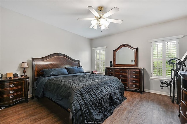 bedroom with ceiling fan and dark wood-type flooring