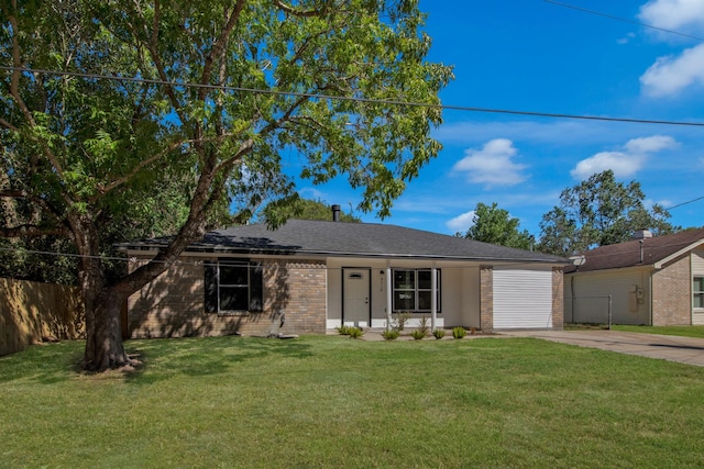 ranch-style home featuring a garage and a front lawn