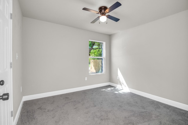 unfurnished room featuring ceiling fan and carpet floors