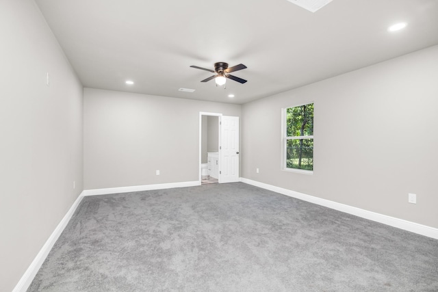 unfurnished room featuring ceiling fan and carpet flooring