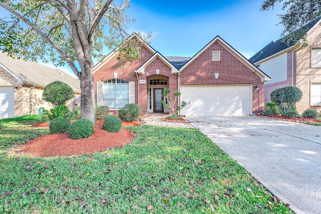 view of property featuring a garage and a front lawn