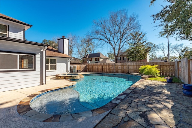 view of swimming pool with an in ground hot tub and a patio