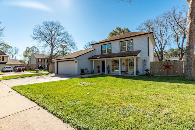 view of front of house featuring a porch, a front yard, and a garage