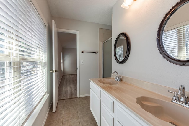 bathroom with vanity and tile patterned floors