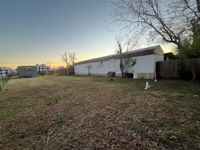 view of yard at dusk