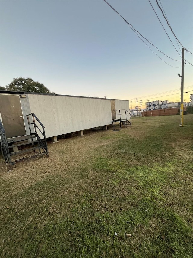 view of yard at dusk