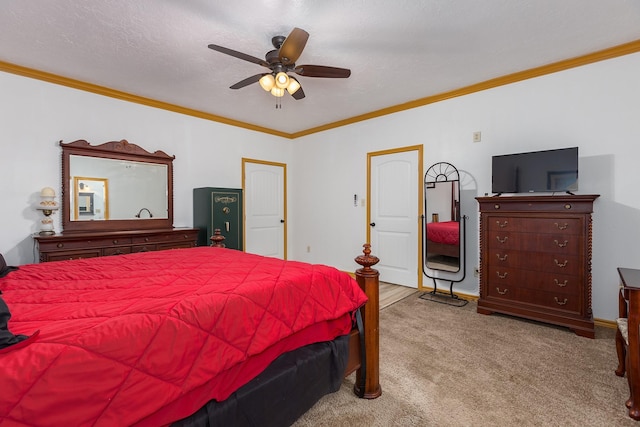 bedroom with a textured ceiling, light colored carpet, ceiling fan, and crown molding