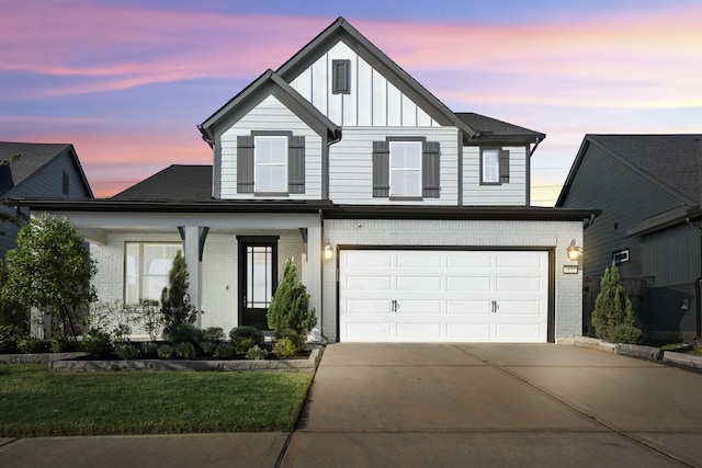 view of front facade with a lawn and a garage