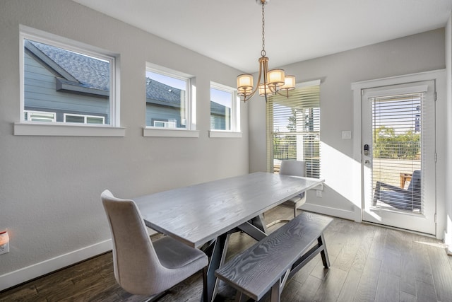 dining space featuring a chandelier and dark hardwood / wood-style floors