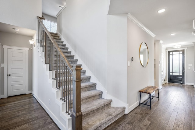 entrance foyer featuring dark hardwood / wood-style flooring and ornamental molding