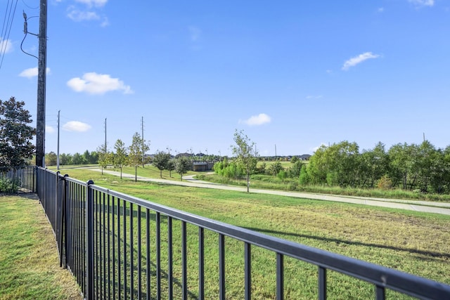 view of yard with a rural view