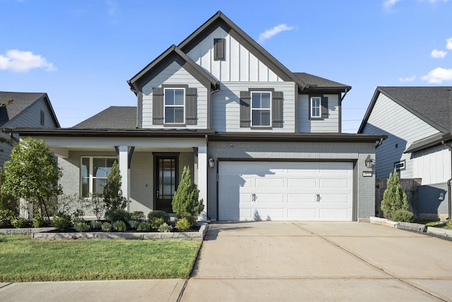 view of front of home featuring a garage and a front lawn