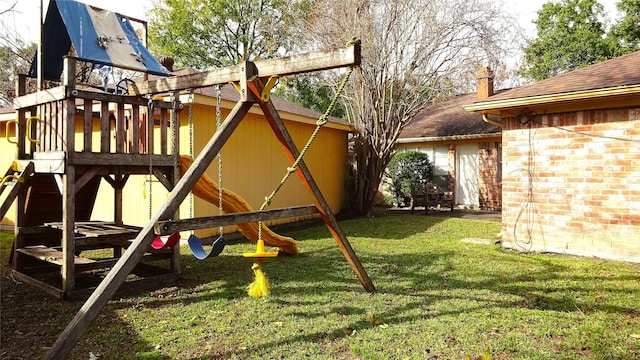 view of play area featuring a lawn