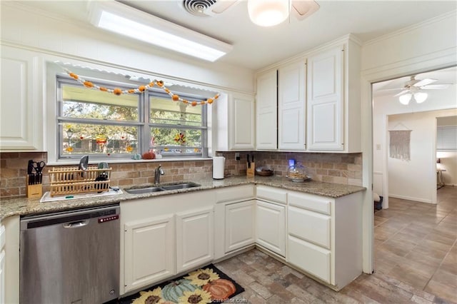 kitchen featuring white cabinetry, dishwasher, light stone countertops, and sink