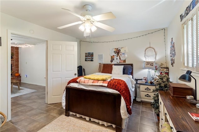 tiled bedroom featuring ceiling fan