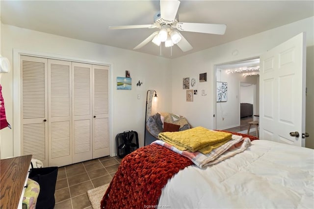 bedroom featuring tile patterned flooring, a closet, and ceiling fan