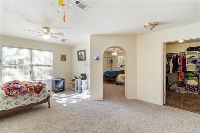 sitting room with carpet floors and ceiling fan