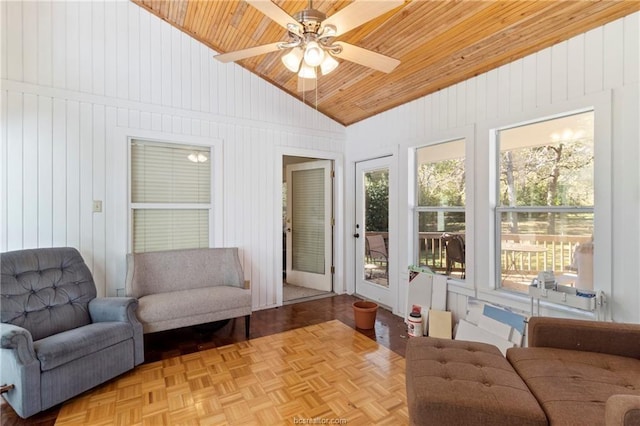 sunroom with ceiling fan, wood ceiling, and vaulted ceiling