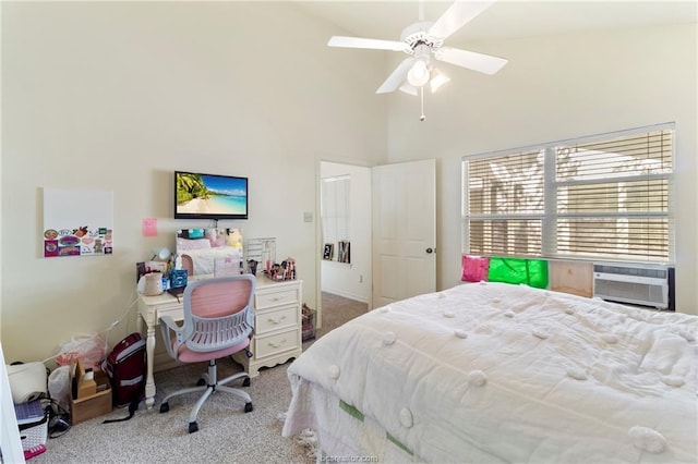 bedroom featuring light carpet, a high ceiling, ceiling fan, and cooling unit