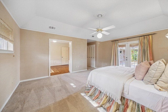 carpeted bedroom with access to exterior, french doors, ceiling fan, crown molding, and lofted ceiling