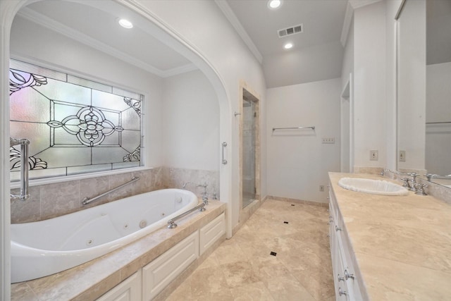 bathroom featuring separate shower and tub, vanity, and ornamental molding