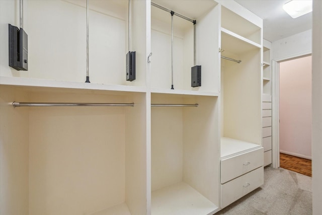 spacious closet featuring light parquet flooring