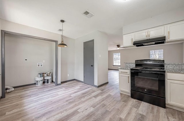 kitchen with light hardwood / wood-style flooring, ceiling fan, light stone countertops, black range with electric cooktop, and white cabinetry