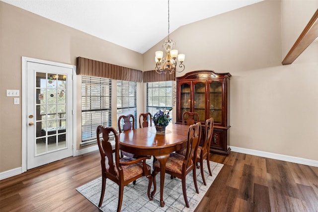 dining area with an inviting chandelier, lofted ceiling, and dark hardwood / wood-style floors