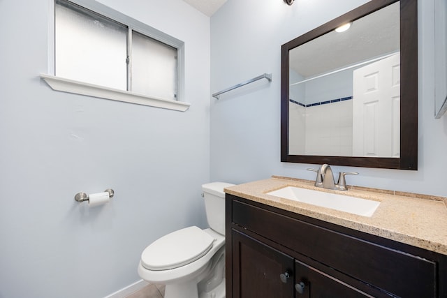 bathroom with walk in shower, vanity, and toilet