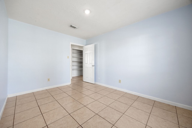 view of tiled spare room