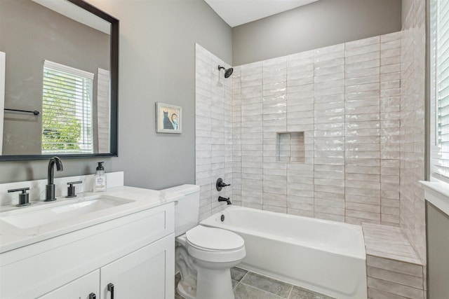 full bathroom with tile patterned floors, toilet, vanity, and  shower combination