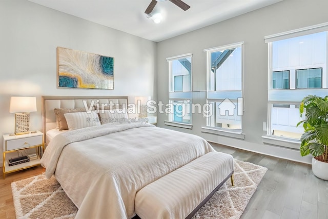 bedroom featuring a ceiling fan and wood finished floors