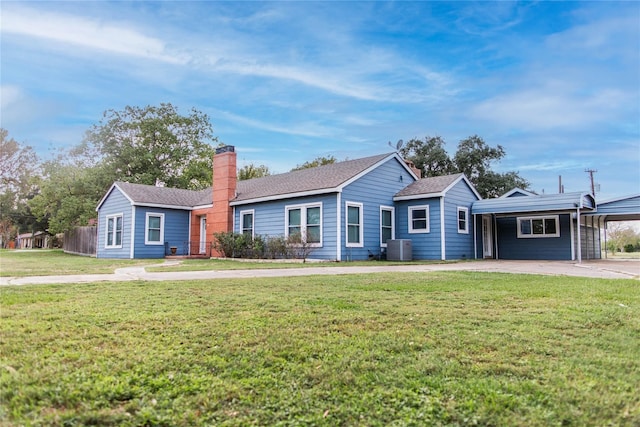 single story home with cooling unit, a front yard, and a carport