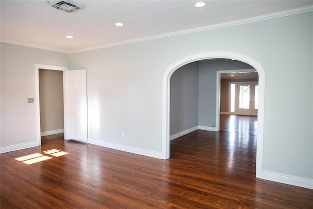 unfurnished room with french doors, dark hardwood / wood-style floors, and crown molding