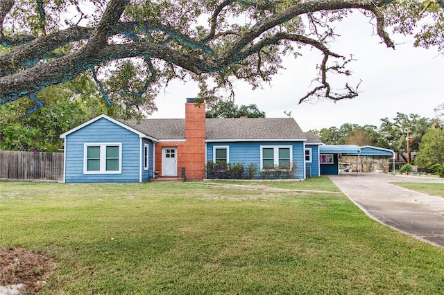 single story home featuring a carport and a front yard