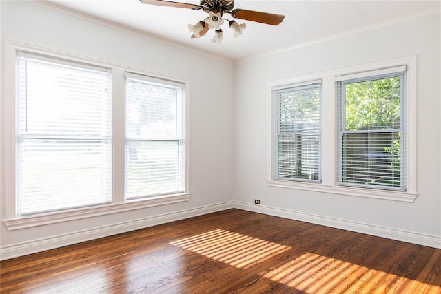 spare room with dark hardwood / wood-style floors, ceiling fan, and ornamental molding