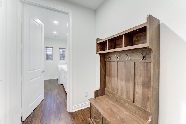 mudroom with dark hardwood / wood-style floors