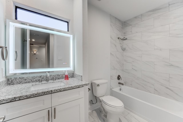 full bathroom featuring toilet, tiled shower / bath, and vanity