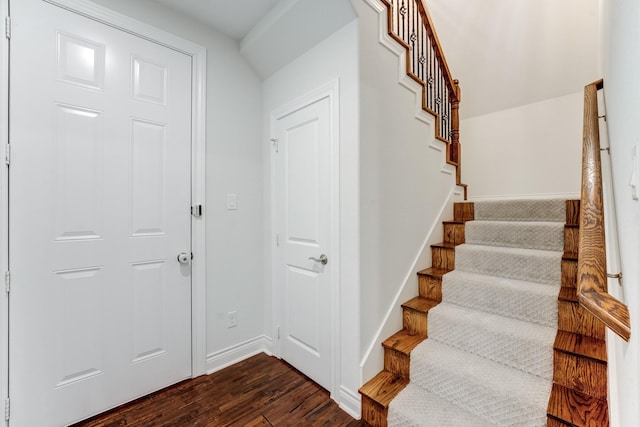 stairway featuring hardwood / wood-style flooring