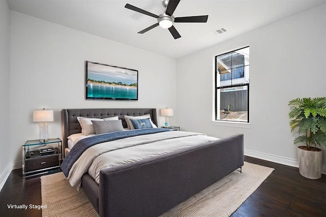 bedroom featuring ceiling fan and dark hardwood / wood-style floors