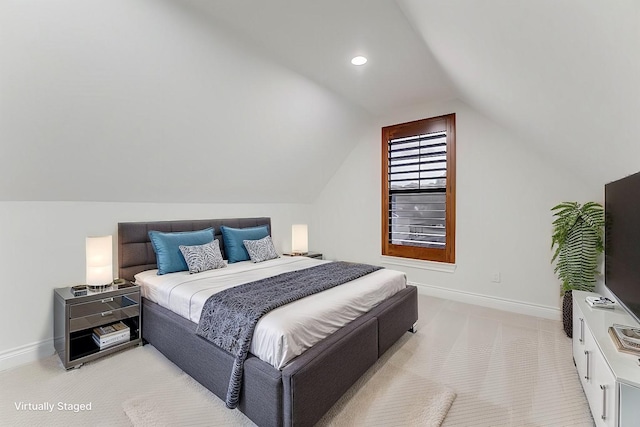 bedroom featuring lofted ceiling and light colored carpet