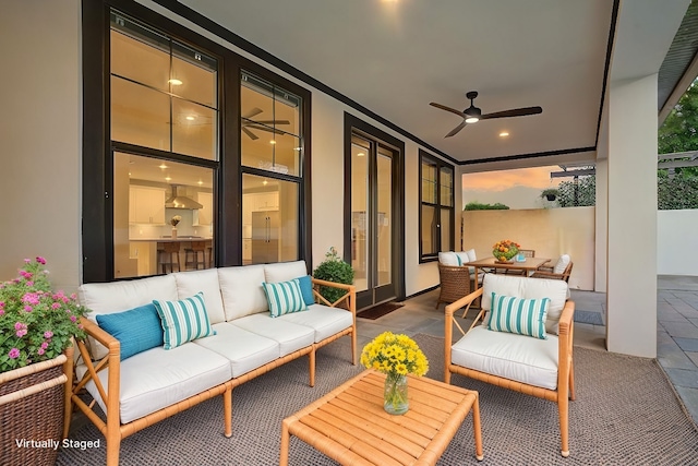 view of patio with ceiling fan and an outdoor hangout area