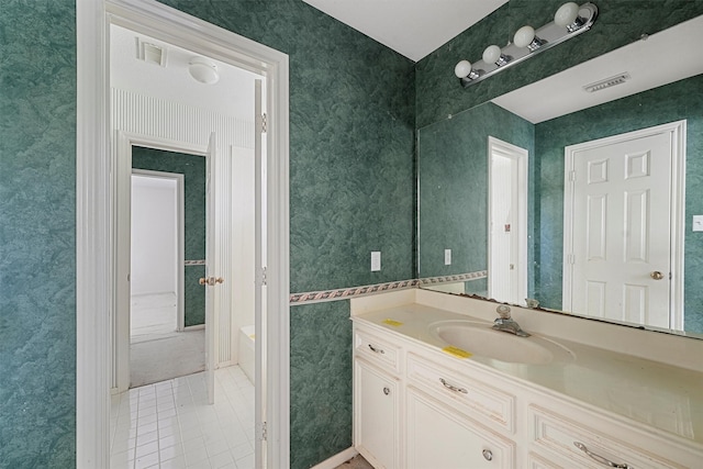 bathroom featuring tile patterned flooring and vanity