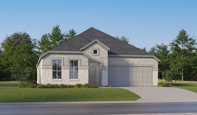 view of front of house with a front yard and a garage